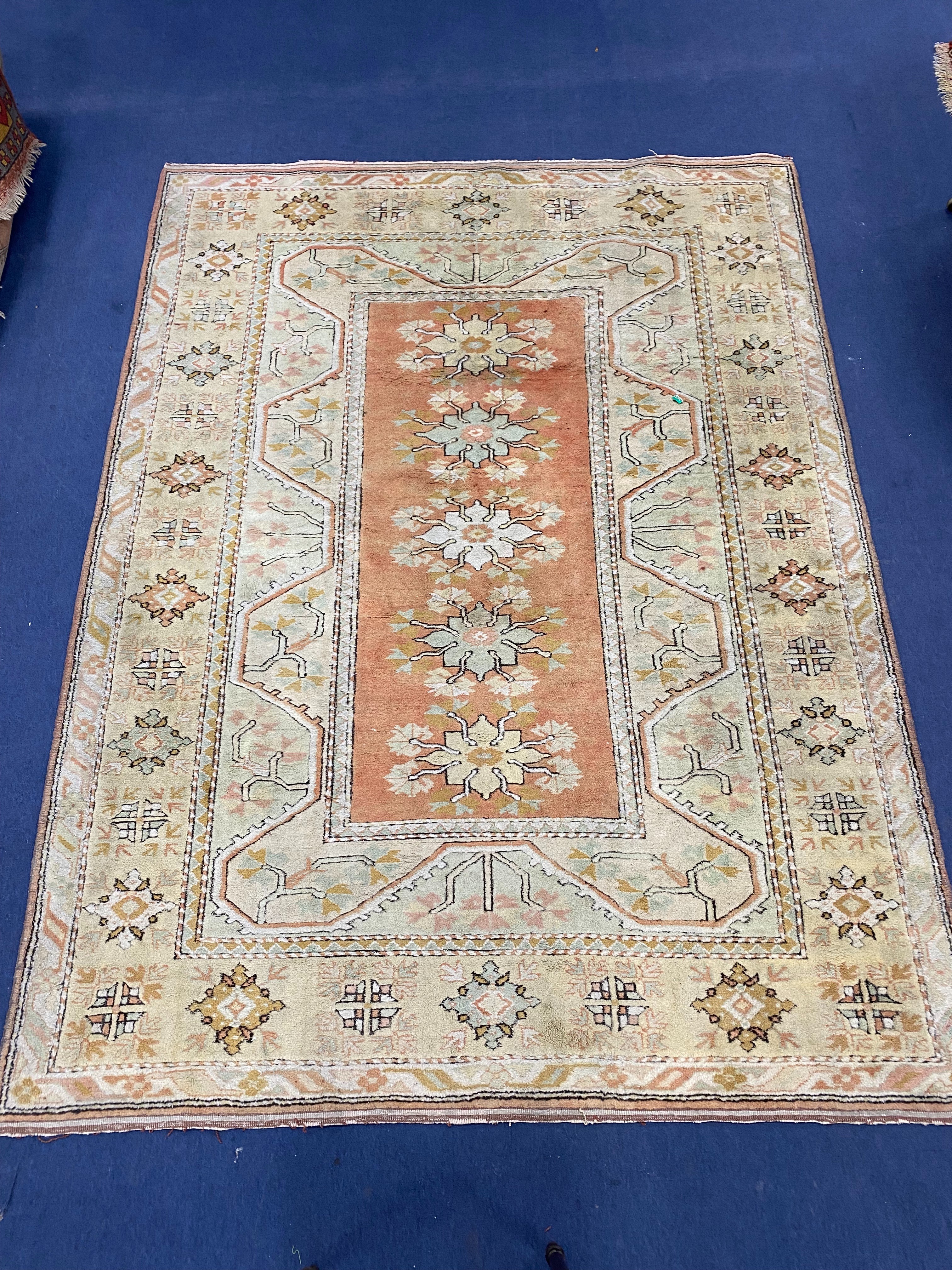A Turkish pale green ground rug, 270 x 196cm